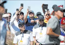  ?? K.M. Cannon Las Vegas Review-journal ?? Fans take photos Kevin Na and Phil Mickelson during last year’s Shriners Hospitals for Children Open. Because of the pandemic, spectators aren’t allowed this year.