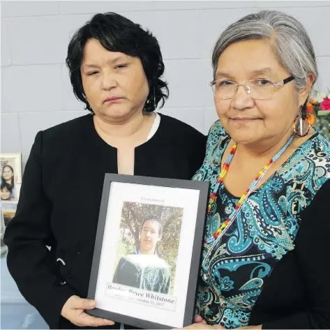  ?? MORGAN MODJESKI ?? Dorothy Laboucane, the mother of 22-year-old Brydon Bryce Whitstone, holds a photo of her son alongside Whitstone’s aunt, Ruth Lewis at the Onion Lake Communiple­x Hall Saturday. He was shot and killed in an RCMP-involved shooting on Oct. 21.