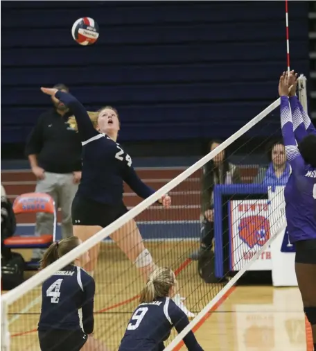  ?? NICOLAUS CZARNECKI / HERALD STAFF FILE ?? BACK IN ACTION: Needham’s Lila Carr spikes the ball against Boston Latin during a match in November 2019. The 2019 Div. 1 champion from the Central/West section is seeking a return to glory.