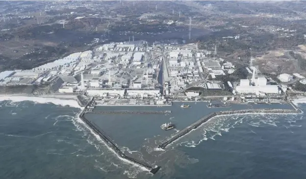  ?? PICTURE: AP ?? 0 Reactor buildings at the Fukushima Dai-ichi nuclear power plant were damaged by hydrogen explosions caused by the earthquake and tsunami