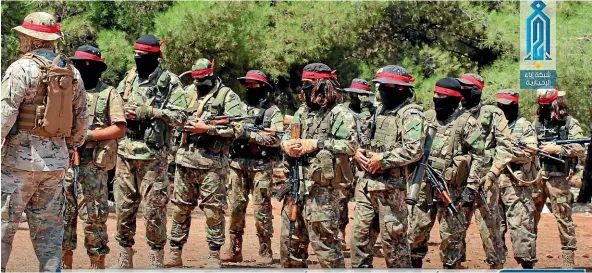  ?? AP ?? This photo provided by the al-Qaeda-affiliated Ibaa News Network, shows fighters of the al-Qaeda-linked coalition known as Hay’at Tahrir al-Sham, Arabic for Levant Liberation Committee, training in Idlib province, Syria.