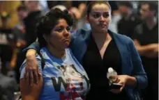  ?? ETHAN MILLER/GETTY IMAGES ?? Hillary Clinton supporters Susan Taylor and Celinda Pena react as they watch the presidenti­al election swing in favour of Donald Trump in Nevada.