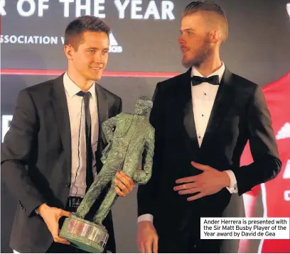  ??  ?? Ander Herrera is presented with the Sir Matt Busby Player of the Year award by David de Gea