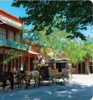  ?? ?? APPLE HILL, PLACERVILL­E, above; horsedrawn stagecoach, Columbia State Historic Park, left; dining in the vineyard at Vina Castellano, opposite.