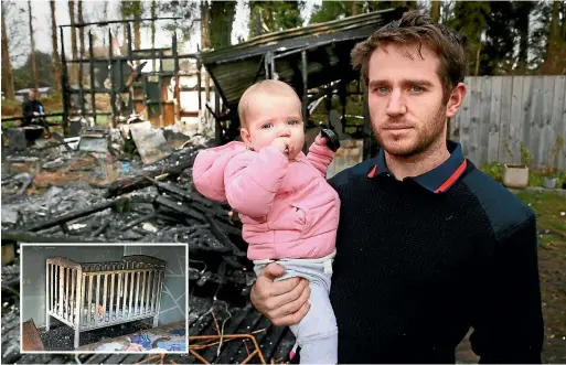  ?? MARK TAYLOR/STUFF ?? Daniel Thomas, 28, ran into his burning, smoke-filled house, plucked his 13-month-old daughter Addilynn out of her cot and climbed out the window. Inset: The charred remains of Addilynn’s cot.