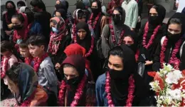  ??  ?? Female footballer­s and family members arrive at the Pakistan football federation’s headquarte­rs in Lahore