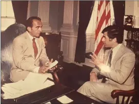  ?? PHOTO COURTESY PETER LUCAS ?? Peter Lucas listens as Gov. Michael Dukakis sits for an interview.