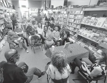  ?? Rick Loomis Los Angeles Times ?? ESO WON, which hosted a book signing last year, has been open for almost 30 years, having survived change in the neighborho­od that was once predominan­tly black but where Spanish is now spoken, among other languages. Some residents welcome and fear...