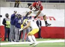  ?? AP photo ?? Alabama running back Najee Harris hurdles Notre Dame cornerback Nick McCloud during the first half of the Rose Bowl on Friday.