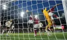  ?? ?? Liverpool goalkeeper Alisson flaps at a corner. Photograph: Tom Jenkins/The Guardian