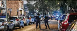  ?? ARMANDO L. SANCHEZ/TRIBUNE NEWS SERVICE ?? With July 4 fireworks exploding in the background, Chicago police work the scene where two people were killed. Last year, the United States saw the highest one-year increase in homicides since it began keeping records.