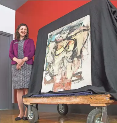  ?? TOM TINGLE/THE REPUBLIC ?? Olivia Miller, curator of exhibition­s for the University of Arizona Museum of Art in Tucson, was ecstatic to have “Woman-Ochre,” a painting by Willem de Kooning, returned 32 years after it was stolen.