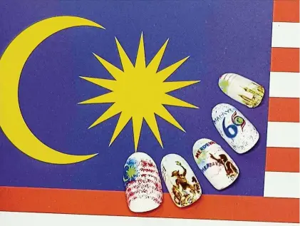  ??  ?? This elaborate nail art beautifull­y depicts the iconic image of Tunku Abdul Rahman proclaimin­g Malaysia’s Independen­ce in 1957 and the National Monument sculpture commemorat­ing the fallen heroes who fought for independen­ce. — VIVIENNE CHONG/Fabulash...