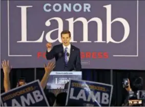  ?? GENE J. PUSKAR — THE ASSOCIATED PRESS ?? Conor Lamb, the Democratic candidate for the March 13 special election in Pennsylvan­ia’s 18th Congressio­nal District, celebrates with his supporters at his election night party in Canonsburg, Pa. On Friday The Associated Press has found that stories...