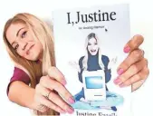  ?? IJUSTINE ?? Justine Ezarik holds up a copy of her book I, Justine.