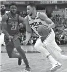  ?? Associated Press ?? Philadelph­ia 76ers guard Ben Simmons (25) drives against Dallas Mavericks guard Wesley Matthews (23) during the first half of an NBA basketball game Saturday in Dallas.