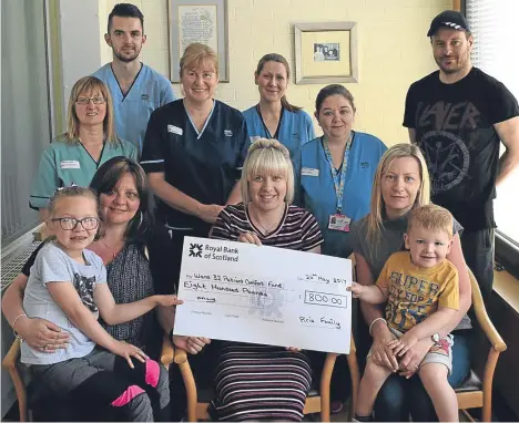  ??  ?? WARD 32 at Ninewells Hospital in Dundee received an £800 donation in memory of Forfar man Bob Pirie.
Bob’s daughter Ashleigh said: “Sadly our dad passed away in May but we collected money at his funeral to donate to Ward 32. The nurses and doctors...