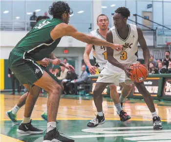  ?? Citizen Photo by James Doyle ?? UNBC Timberwolv­es forward Fareed Shittu looks to make a play with the ball against University of the Fraser Valley Cascades defender Dhivaan Bhogal on Friday night at the Northern Sport Centre.