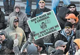  ?? CHIP SOMODEVILL­A/GETTY ?? Thousands of gun-rights advocates attend a rally Monday organized by The Virginia Citizens Defense League on Capitol Square in Richmond, Virginia.