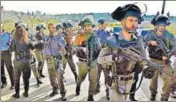  ?? AFP ?? Israeli police and border guards gather at the scene of the attack in West Bank on Tuesday.