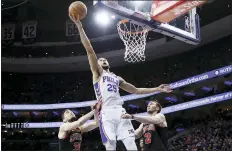  ?? ASSOCIATED PRESS FILE PHOTO ?? Philadelph­ia 76ers’ Ben Simmons (25) goes up for a shot between Chicago Bulls’ Luke Kornet (2) and Tomas Satoransky (31) during the second half of a Feb. 9 game in Philadelph­ia.