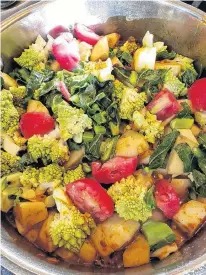  ?? ?? A colourful collection of freshly harvested vegetables and herbs make mealtimes all the more appetizing.