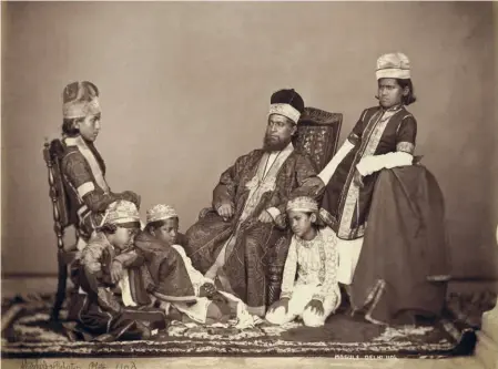  ?? ?? STUDIO PORTRAIT of a Mogul father with his children in Delhi, c. 1860s. by Charles Shepherd & Arthur Robertson.