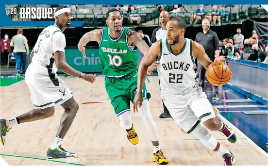  ?? / FOTO: AFP ?? Khris Middleton (22) fue el máximo encestador de Milwaukee.