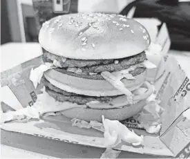  ?? BILL GOODYKOONT­Z/THE REPUBLIC ?? The McDonald’s Double Big Mac, just before The Arizona Republic’s Bill Goodykoont­z ate it.