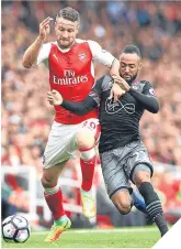  ??  ?? Mustafi and Redmond tussle.