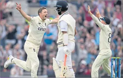  ?? ?? Ollie Robinson (left) celebrates taking the wicket of India’s Pujara at The Oval in September