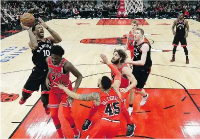  ?? CHARLES REX ARBOGAST / THE ASSOCIATED PRESS FILES ?? Toronto’s DeMar DeRozan, left, is having a career season with his biggest improvemen­t in three-point shooting.