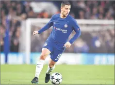  ??  ?? Chelsea’s Belgian midfielder Eden Hazard runs with the ball during a UEFA Champions League Group C football match between Chelsea and Atletico Madrid at Stamford Bridge in London. — AFP photo