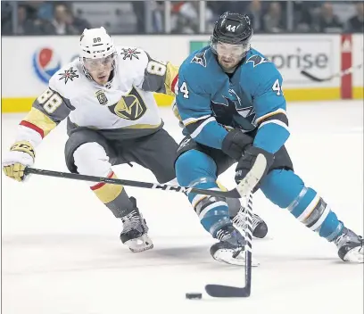  ?? PHOTOS BY NHAT V. MEYER — STAFF PHOTOGRAPH­ER ?? The Sharks’ Marc-Edouard Vlasic (44) tries to get a shot off against the Las Vegas Knights’ Nate Schmidt (88) on Thursday night.