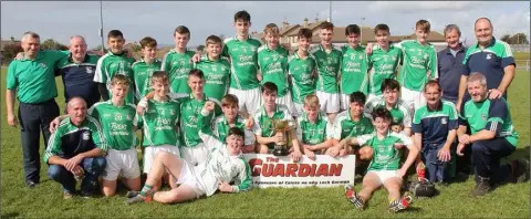  ??  ?? The Juvenile championsh­ip-winning Naomh Eanna squad with their mentors.