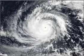  ?? (AP/NASA) ?? This satellite image shows Typhoon Mawar, a powerful storm that could deliver the biggest hit in two decades to the U.S. territory in the Pacific, approachin­g Guam on Tuesday.