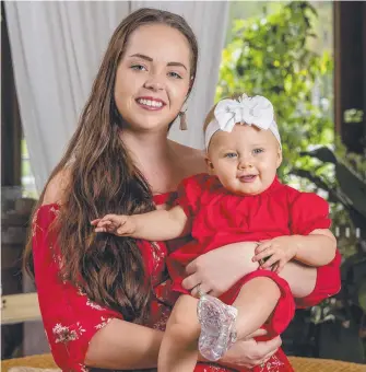  ?? Picture: JERAD WILLIAMS ?? Tani Bloudell and 11-month old Harriet Osborne both suffer from heart conditions. Mr Bloudell is encouragin­g Gold Coasters to wear red to raise awareness of heart health.