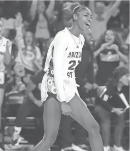  ?? JOE RONDONE/THE REPUBLIC ?? Sun Devils guard Jalyn Brown (23) celebrates her made shot against the Washington Huskies on Friday at Desert Financial Arena in Tempe.