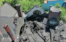  ?? Matt Freed/Post-Gazette ?? The roof of Christian Fellowship Center Church on McClure Avenue on the North Side collapsed Monday.