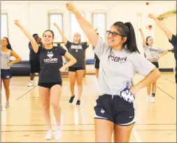  ?? Ned Gerard / Hearst Connecticu­t Media ?? Senior Ashley DeCarlo, of Bethel, practices with her Spirit, Pride and Tradition teammates Aug. 20 as they prepare for the upcoming sports seasons at the University of Connecticu­t in Storrs.