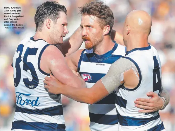  ?? Picture: GETTY IMAGES ?? LONG JOURNEY: Zach Tuohy gets some love from Patrick Dangerfiel­d and Gary Ablett after scoring against the Eagles.