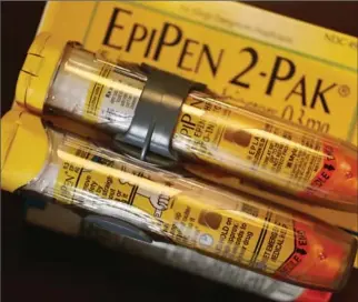  ?? JOE RAEDLE, GETTY IMAGES ?? Mylan said that more than half the amount paid by the health care system for EpiPens goes to pharmacy benefit managers, insurers, wholesaler­s and pharmacy retailers, not to the company itself.