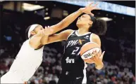  ?? Ralph Freso / Associated Press ?? Phoenix Mercury forward Brianna Turner, right, is fouled by Chicago Sky center Candace Parker during the first half on Sunday.