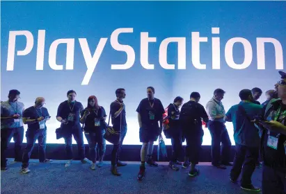  ?? Kevork Djansezian/ Getty Images/
TNS ?? ABOVE: Gamers wait in line to enter the Sony Playstatio­n booth during the annual E3 2016 gaming conference at the Los Angeles Convention Center in June 2016 in Los Angeles,
Calif.