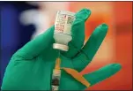  ?? RAY CHAVEZ — BAY AREA NEWS GROUP ?? Medical assistant Aurora Vallejo prepares doses of Moderna COVID-19 vaccines at a vaccinatio­n center run by La Clinica de la Raza in Oakland on March 11.