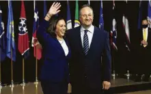  ?? Olivier Douliery / AFP via Getty Images ?? Texas Democrats hope vice presidenti­al running mate Kamala Harris, shown with husband Douglas Emhoff, will excite voters.