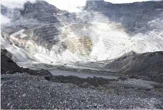  ?? REUTERS ?? TRUCKS OPERATE in the open-pit mine of PT Freeport’s Grasberg copper and gold mine complex near Timika, in the eastern region of Papua, Indonesia on Sept. 19, 2015 in this photo taken by Antara Foto.