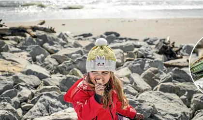  ??  ?? Zofia, 4, finishes her icecream in the late afternoon in Hokitika.