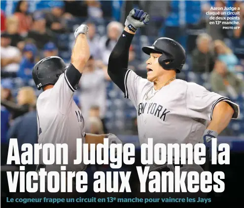  ?? PHOTO AFP ?? Aaron Judge a claqué un circuit de deux points en 13e manche.