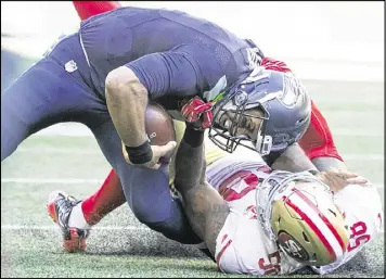  ?? SEATTLE TIMES ?? Seahawks quarterbac­k Russell Wilson practiced Wednesday and is expected to play this week despite sustaining a sprained MCL on this play against the 49ers.